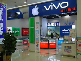 a store sign with logos for both Apple and Vivo