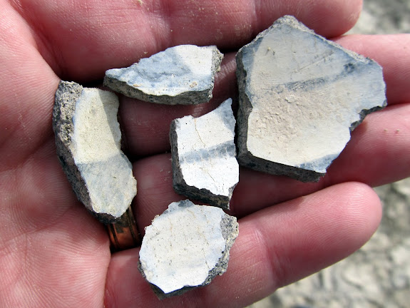 Potsherds from the same pot that appears to have been painted on the inside