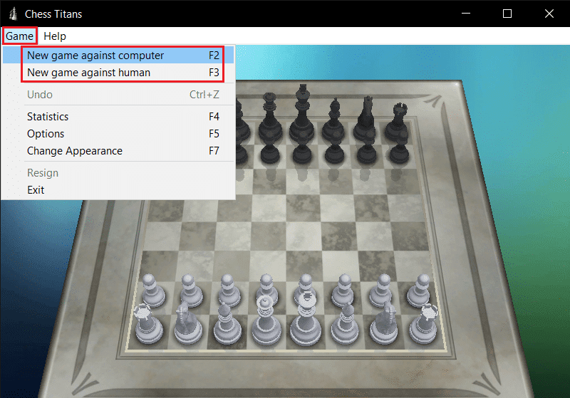 seleccione un nuevo juego contra computadora o humano en el menú desplegable del juego Chess Titans