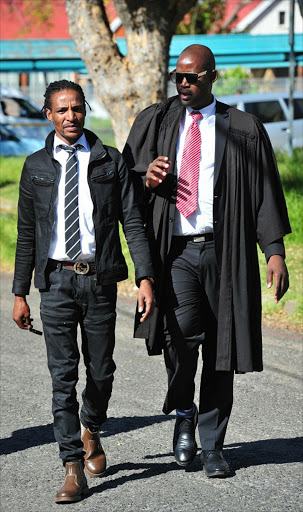 'Kwaito musician Sipho Brickz Ndlovu and his lawyer Dumisani Mabunda. Pic Veli Nhlapo/Sowetan