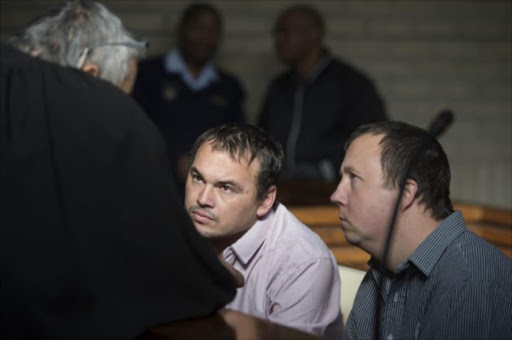 From left: Willem Oosthuizen and Theo Jacobs appear at the High Court sitting at the Middleburg Magistrates court in Mpumalanga ahead of sentencing proceedings. The pair have been convicted of assault after forcing Victor Mlotshwa into a coffin and threatening to set him alight. Picture: ALAISTER RUSSELL
