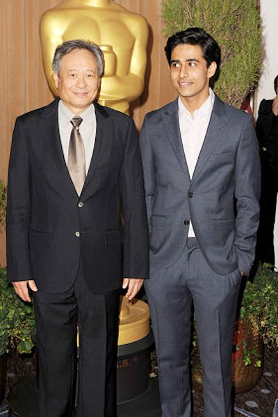 Director Ang Lee (L) and actor Suraj Sharma pose for the cameras during the 85th Academy Awards Nominations Luncheon at The Beverly Hilton Hotel in Beverly Hills, California, on February 4, 2013.  