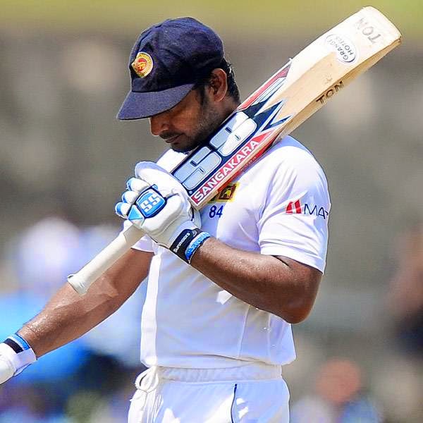 Sri Lankan batsman Kumar Sangakkara walks back to the pavilion after his dismissal during the final day of the opening Test match between Sri Lanka and South Africa at the Galle International Cricket Stadium in Galle on July 20, 2014.