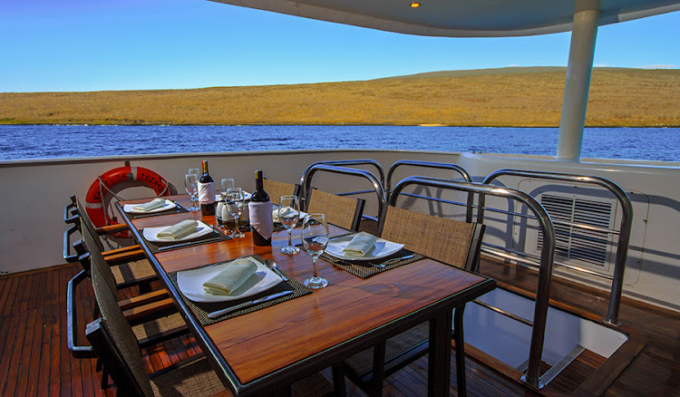 Dine on Ecuadorian and international dishes in an al fresco setting during your voyage on Treasure of Galapagos.