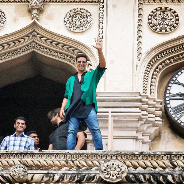 Bollywood actor Akshay Kumar waves from the top of a 16th century historical landmark Charminar during a promotional event for of upcoming movie Boss in Hyderabad, Friday, Oct. 11, 2013.