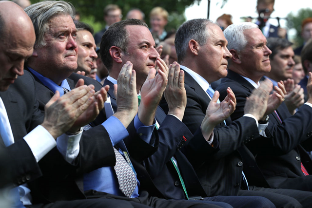 Members of the Trump regime clap along like subservient children as President Donald Trump announces America’s withdrawal from the Paris Accord on 1 June 2017. Pictured are Steve Bannon, Scott Pruitt, and Mike Pence. Photo: Chip Somodevilla / Getty Images