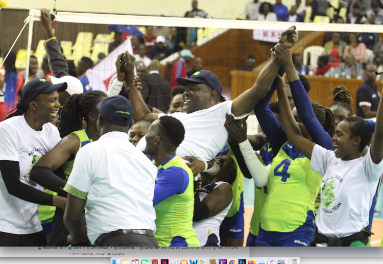 KCB players carry their coach Japheth Munala shoulder high as they celebrate the KVF league victory at Moi Stadium, Kasarani yesterday.