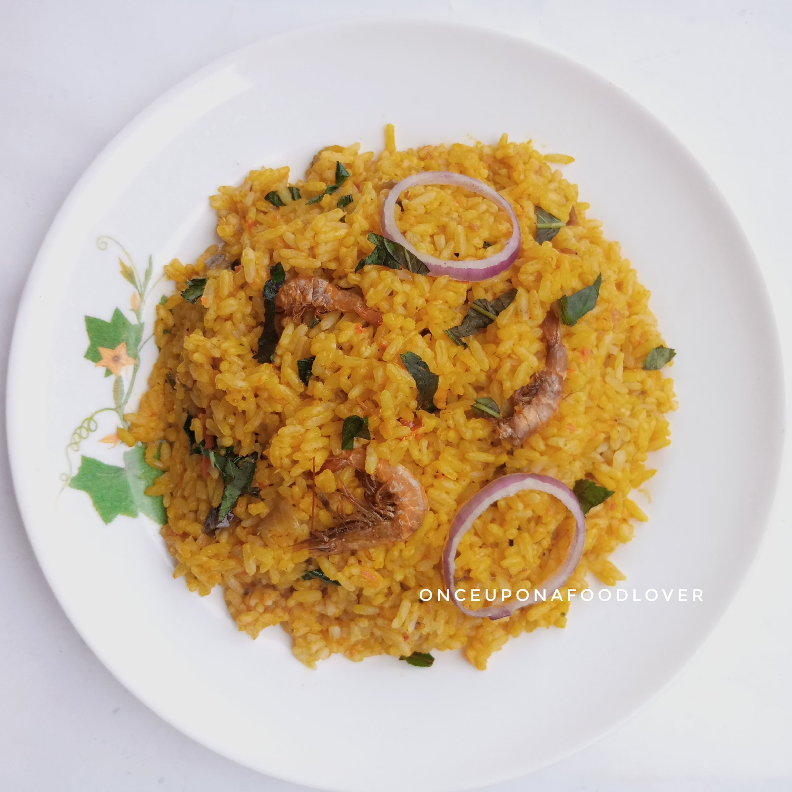 A plate of Palm Oil Rice also known as Native Jollof Rice