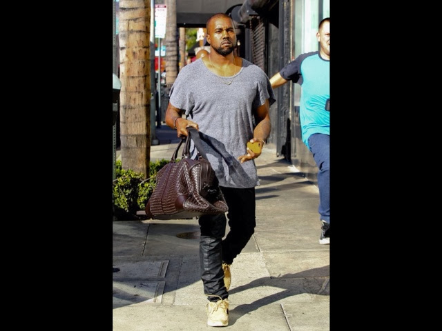 David Beckham toting Louis Vuitton Neo Greenwich bag