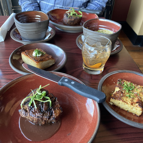 Filet Mignon and sides of potatoes, cauliflower Augratin, mushrooms.