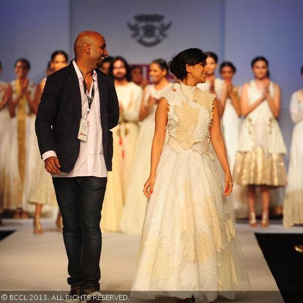 Fashion Designer Samant Chauhan and actress Pallavi Sharda walk the ramp on Day 2 of the Wills Lifestyle India Fashion Week (WIFW) Spring/Summer 2014, held in Delhi.