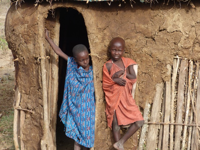 Two boys at their Boma — home. From Want to go on Safari in Tanzania? Read this first...