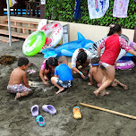 kids at enoshima beach in japan in Fujisawa, Japan 