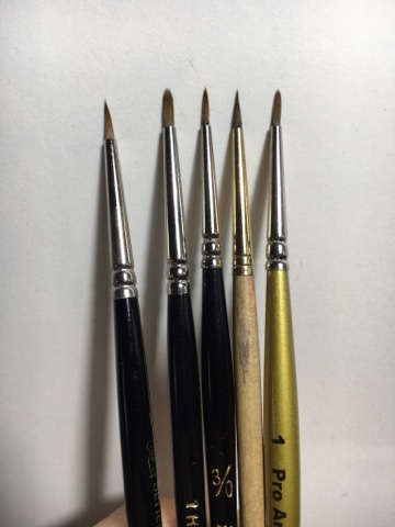 Paintbrushes splayed slightly Paintbrushes splayed slightly