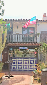 Fiesta De Reyes in Old Town San Diego, behind these little booths you can get fresh tortillas that are put into street tacos, made right before your eyes. But, don't take your margarita with you when you order!