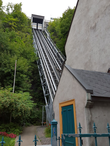 Even the grey building for the funicular has a brilliantly painted door! Old Quebec City's Maze of Streets Reveals Crazy, Colorful Painted Doors