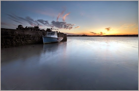 fishing-boat-docked-at-sunset-326737