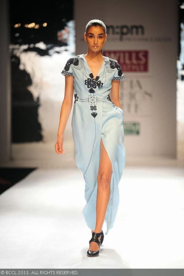 Former Miss India Kanishtha Dhankar showcases a creation by fashion designers Ankur Modi and Priyanka Modi on Day 2 of Wills Lifestyle India Fashion Week (WIFW) Spring/Summer 2014, held in Delhi.