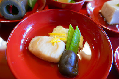 Details of one of the dishes as part of our set of shojin-ryori lunch at Shigetsu, Tenryu-ji's Zen Vegetarian Restaurant. In the back is is yuba, or tofu skin and to the left the rectangle is Nama-fu or wheat gluten. The vegetables are pea pods and a mushroom.