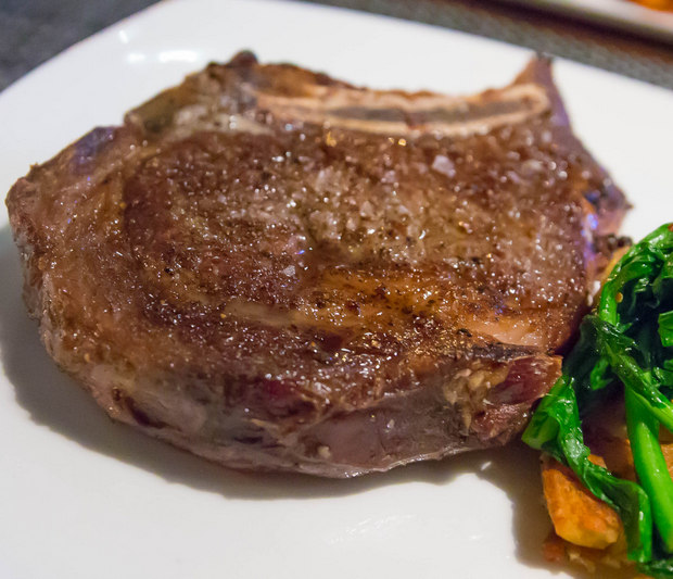 close-up photo of a Dry Aged Bone-In Rib Eye