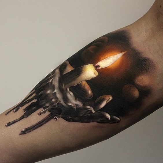 vela_mo_antebraço_tatuagem vela_mo_antebraço_tatuagem