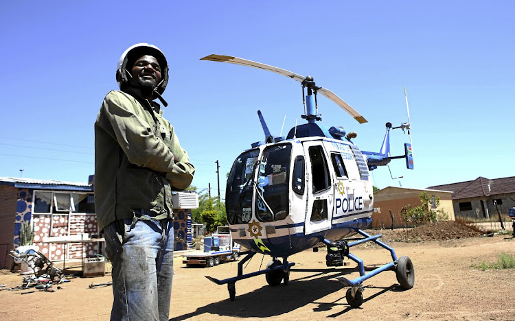 Hendrick Chebanga with his replica police helicopter, which took him eight months to build.