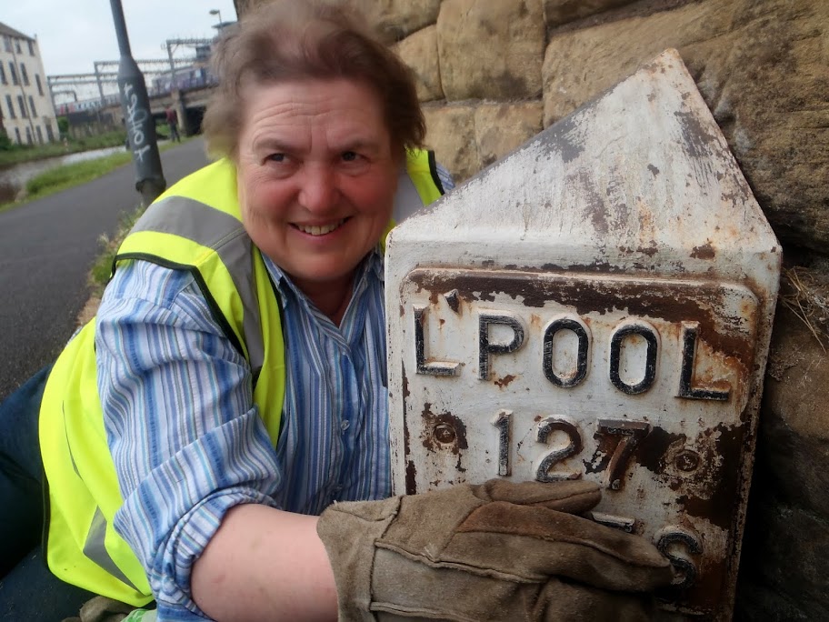 Elaine working on a Leeds Milepost