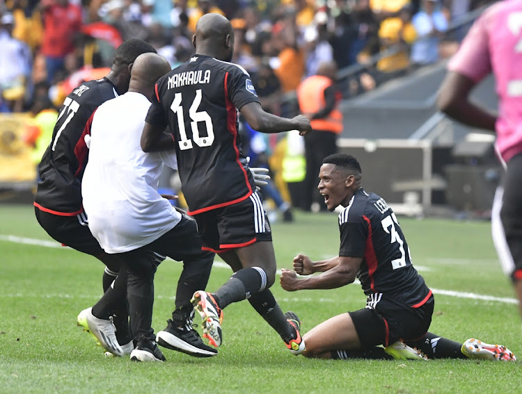 Thabiso Lebitso of Orlando Pirates is joined by fellow players and a Bucs medical official to celebrate his goal against Kaizer Chiefs at FNB Stadium on Saturday.