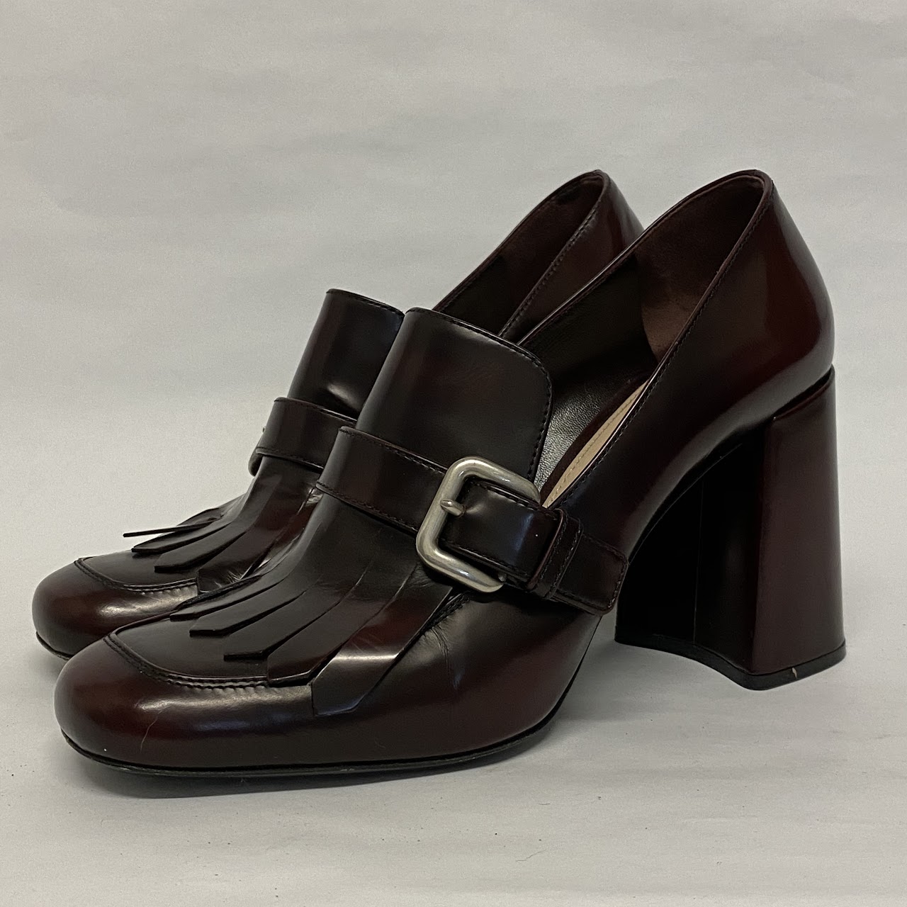 Prada Burgundy Kiltie Pumps