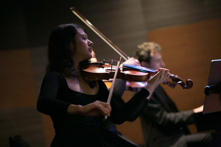 Anna Vosbigian, violinist with Lincoln Center Stage, performs on ms Oosterdam.