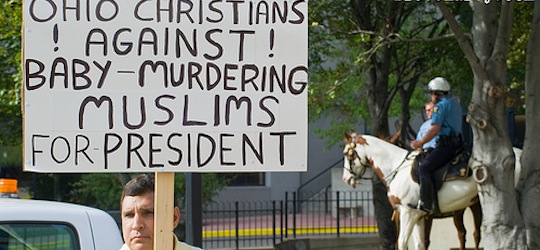 Man carrying political sign