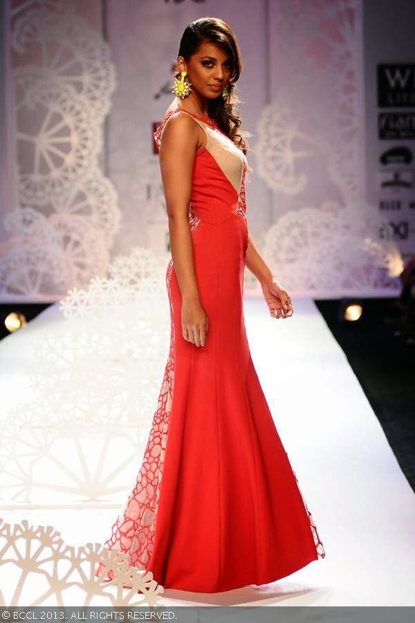 Mugdha Godse walks the ramp for fashion designer duo Paras and Shalini on Day 1 of the Wills Lifestyle India Fashion Week (WIFW) Spring/Summer 2014, held in Delhi.