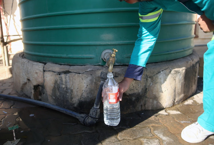 The community of Hammanskraal fill water from Jojo tanks. The city has cautioned residents against buying water from tankers selling it. File photo.