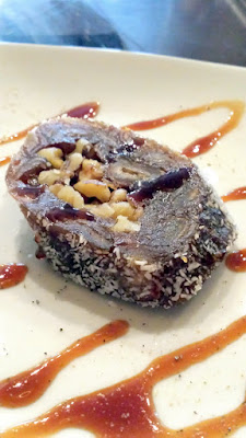 DarSalam Lazurdi Date Roll, tender dates wrapped around walnuts and rolled in coconut flakes then drizzled with date honey