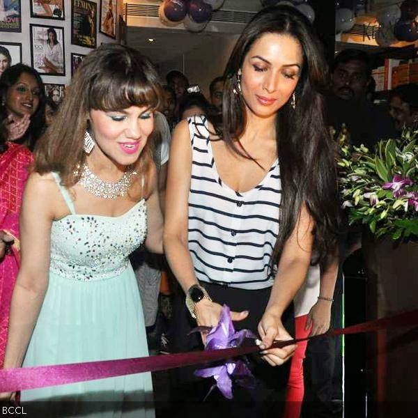 Marvie Ann Beck with actress Malaika Arora Khan as she does the honours at the former's spa launch, held in Mumbai, on October 9, 2013. (Pic: Viral Bhayani)