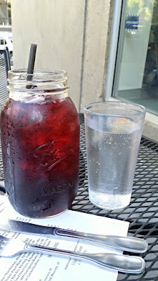 Patio Punch Mason Jar at Pink Rose Restaurant - a quart of your choice of Sangria or Blueberry Basil, Citrus Sage punches with your choice of vodka, gin, tequila, rum, bourbon well or call.