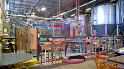 Oskar Blues Tasting Room the Tasty Weasel - a small room on the left gives you a glimpse of the canning production plus skeeball and seating for drinking your beer