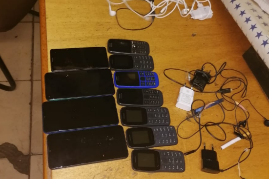 Some of the cellphones and chargers seized from inmates during the search.