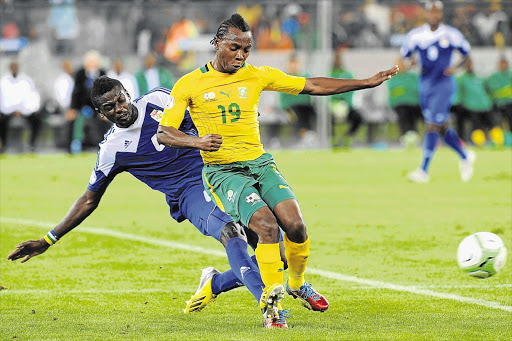 Bafana's May Mahlangu battles for the ball with Salif Keita of Central African Republic during their 2014 World Cup qualifier match at Cape Town Stadium on March 23. He has been ruled out of action for several months after rupturing his Achilles tendon