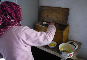 woman making tsampa in Qinghai, China