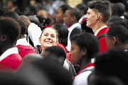 BLENDING IN: German exchange students Laura Fricke and Joschka Geczy during assembly on the first day of school at Ponelopele Oracle Secondary School in Ivory Park, Midrand, yesterday