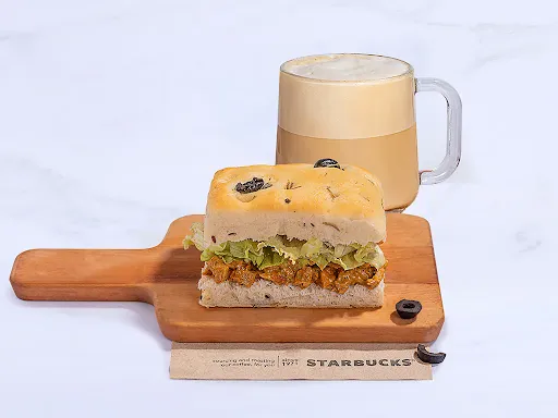 Tall Cappuccino With Herbed Chicken Focaccia Sandwich