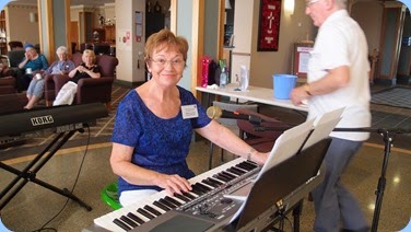 Diane Lyons setting-up to play on her Korg Pa900. Photo courtesy of Dennis Lyons.