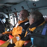 "Rudy and JP give each other look of relief - Ben and rescue swimmer Drew Dazzo still in water." courtesy of Commander Nevada Smith a - Ben and JP give each other look of relief - Ben and rescue swimmer still in water..png