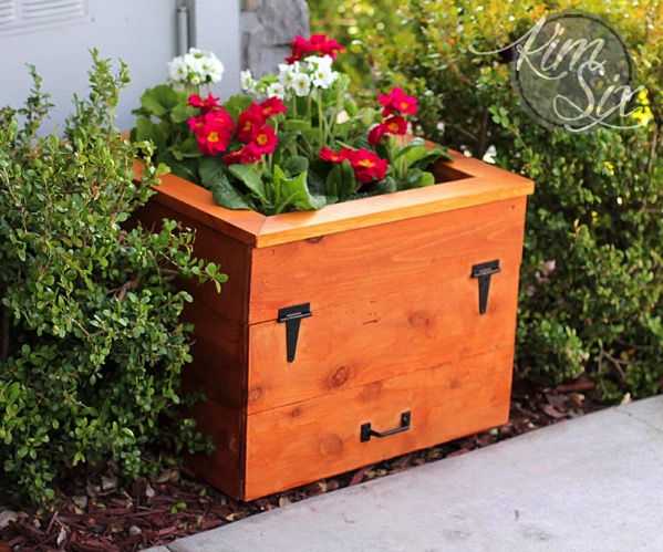 Hose Storage Hidden In Flower Planter