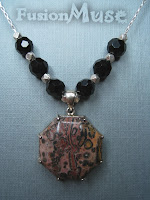 5. Leopard Jasper and Sterling Silver. A One of a Kind Octagonal Leopard Jasper stone sits central in this lovely necklace. The surrounding beads are shiny faceted Black Onyx and Karen Fine Silver. The long box Sterling Silver  chain is approx 18 inches long and has an easy to use lobster spring clasp. The matching earring (not pictured here) featured the same shiny Black Faceted Onyx and sway as you move.