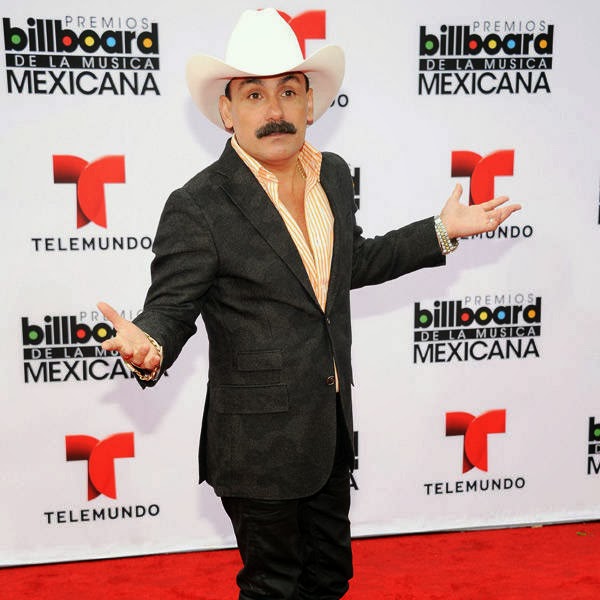 El Chapo De Sinaloa gestures as he arrives for the 3rd Annual Billboard Mexican Awards, held at The Dolby Theatre in Los Angeles on October 9, 2013.