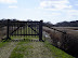 A gated track that leads between Dingle Great Hill and East Hill