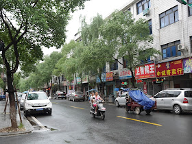 two women riding a motorbike in Changde