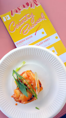 Portland Monthly Country Brunch 2016 - Brunch Bite by Screen Door of Shrimp & Grits, wild caught gulf shrimp sauteed with country ham, garlic, tomato, and white wine over parmesan spoon bread